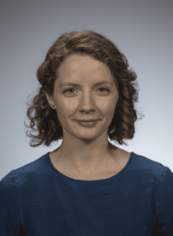 The image is of Brodwen McBain, a woman with short curly brown hair